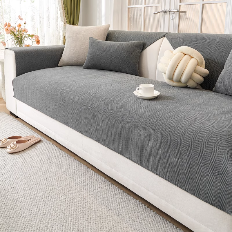 Charcoal gray herringbone chenille sofa cover on white modern sofa - neutral home decor