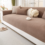 Mocha brown herringbone sofa cover styled on modern white sofa - premium sofa protection