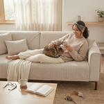 Grandmother sitting with cat on khaki chenille herringbone sofa cover - grandparent-ready living room
