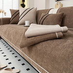 Brown luxurious chenille sofa cover styled on modern sofa with matching arm covers - full coverage sofa protection