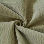 Close-up of soft ribbed morandi chenille fabric in sage green showing texture and flexibility
